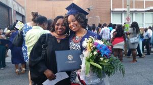 Yanick Rice Lamb with former student Lisa Wilmore after the School of Communications' graduation ceremony.